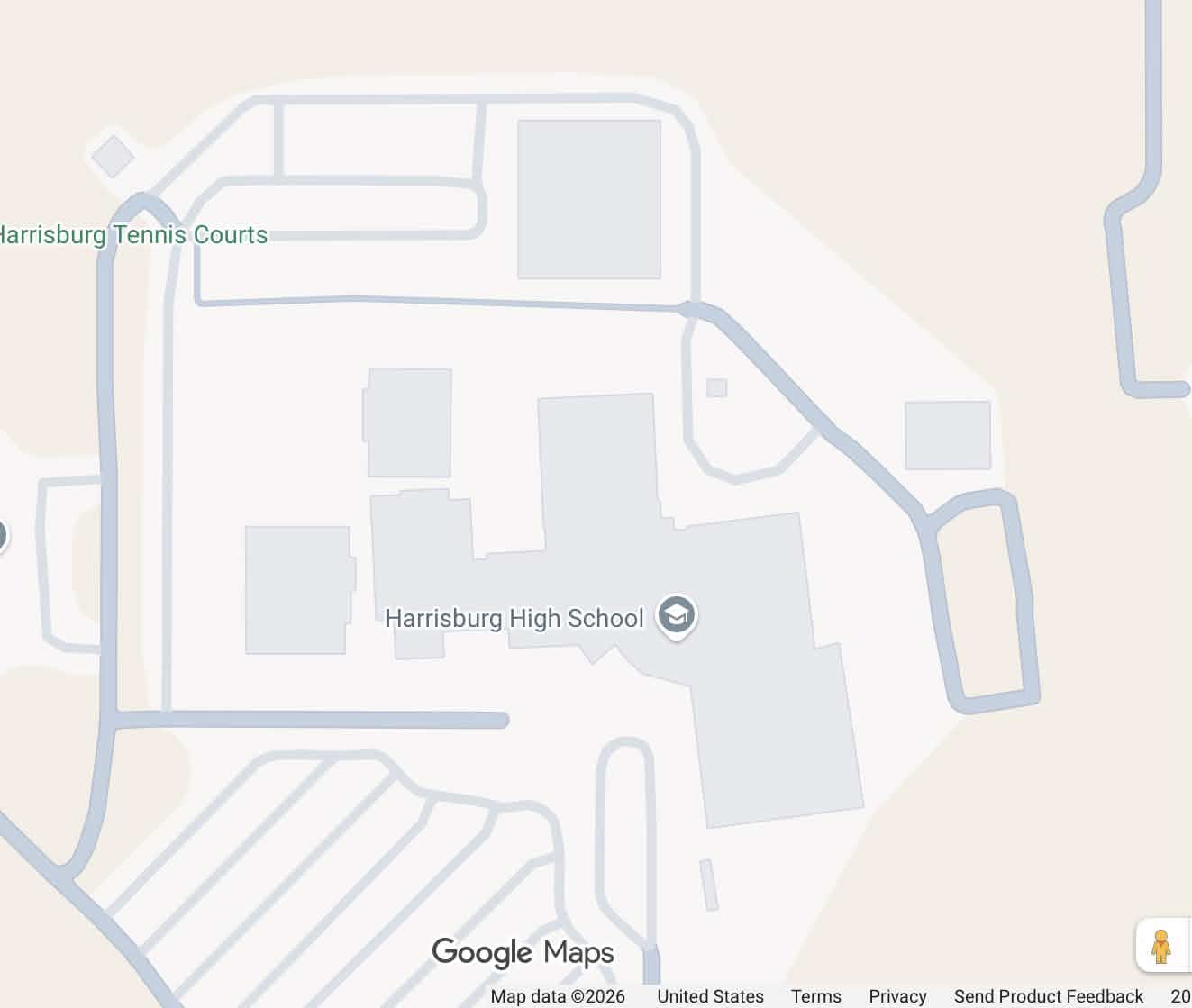 A screenshot of a high school on Google Maps. Several sections of the building are displayed as separate from the main building, and a road on the north side of the building cuts through an area where the building should be.